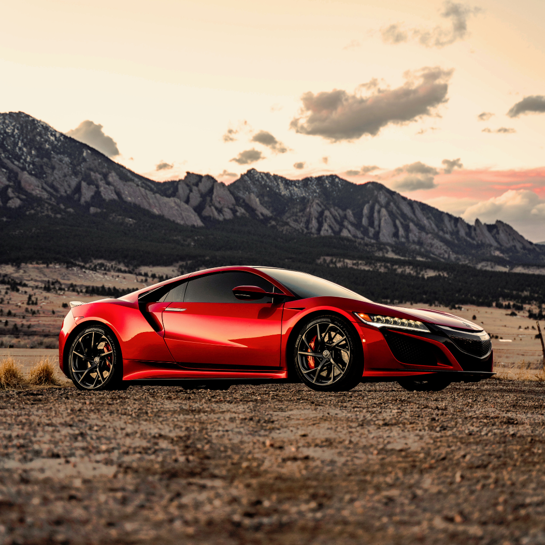 red car in front of mountain