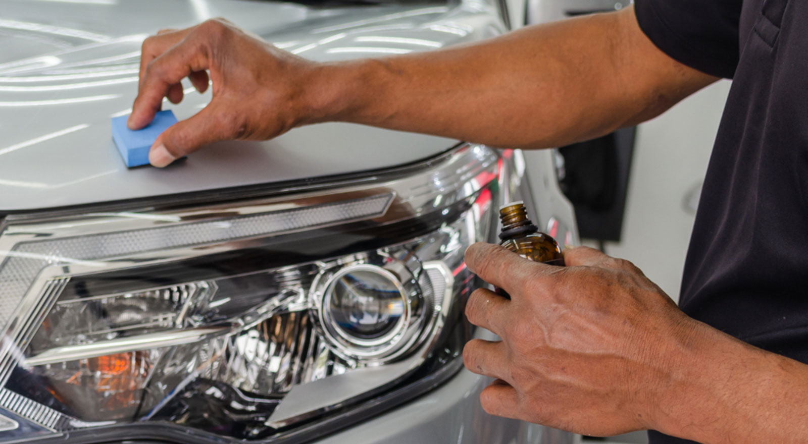 car headlight being detailed