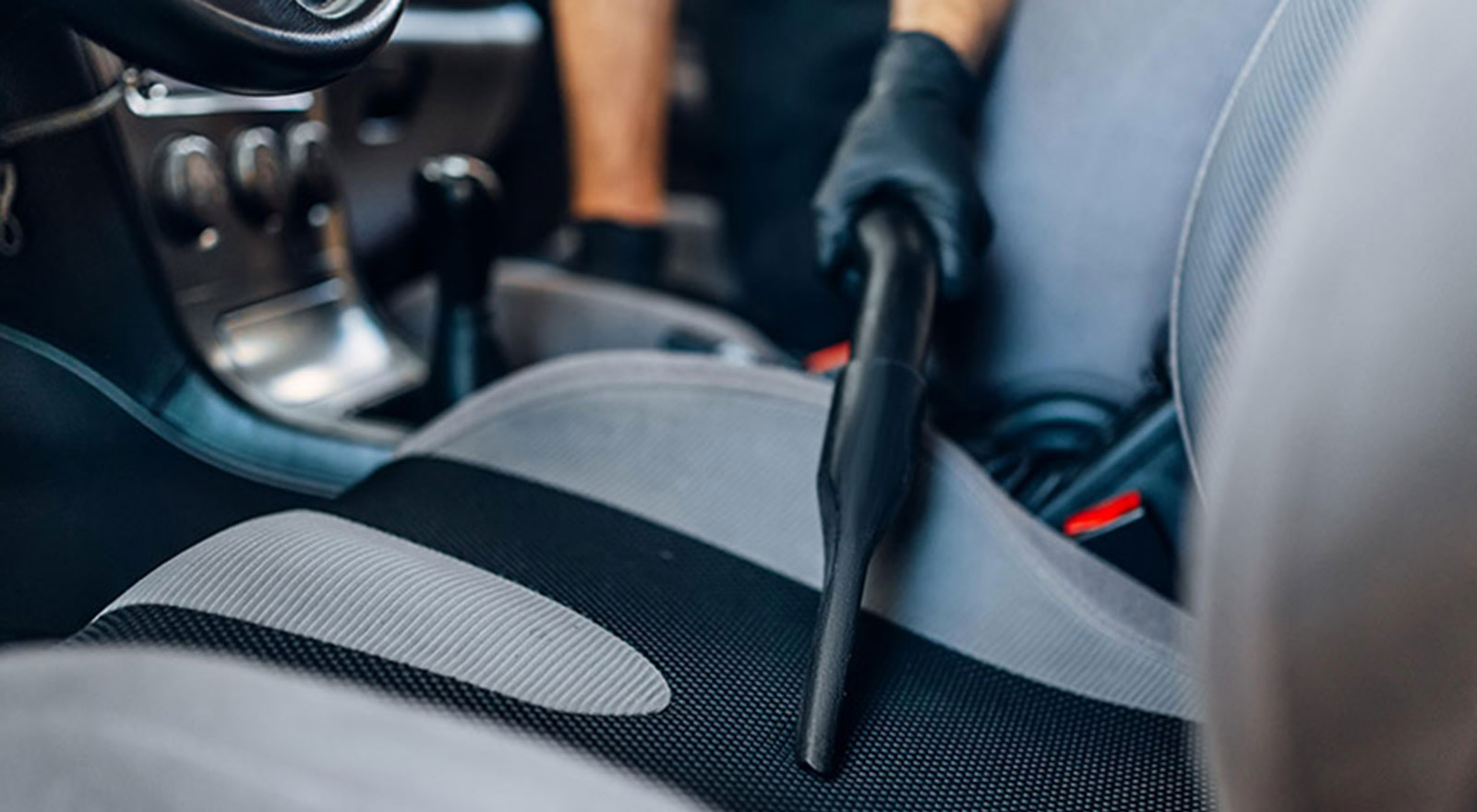 car seat being vacuumed