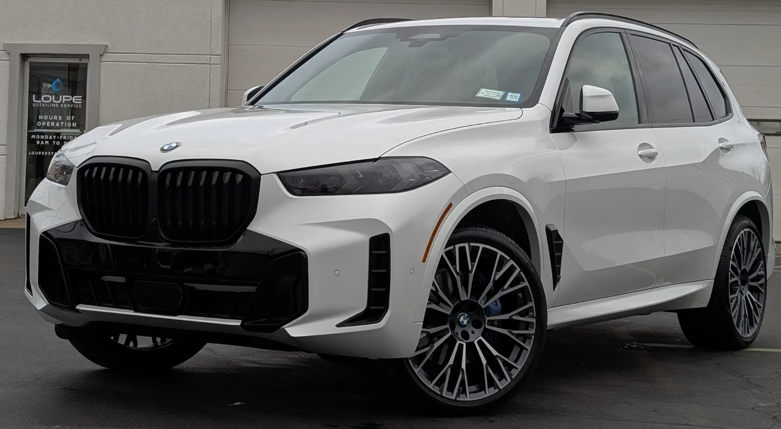 BMW X5 SUV with professional ceramic coating, paint protection, and exterior detailing at Loupe Detailing in Amherst, NY.